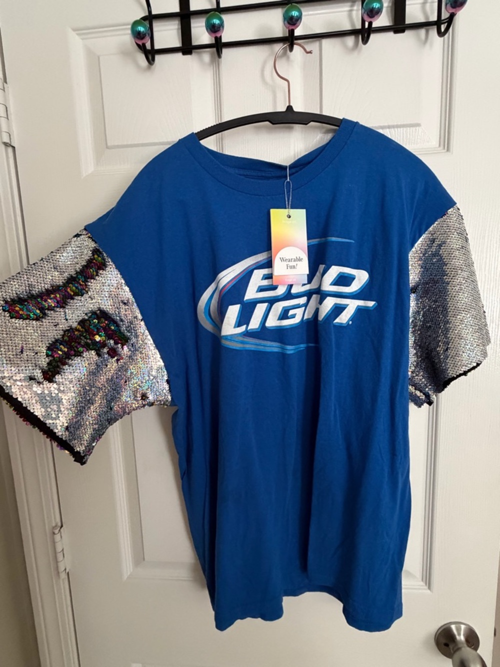 Fringe Studio Pride Blue Bud Light Tee with Silver and Rainbow Sequin Sleeves